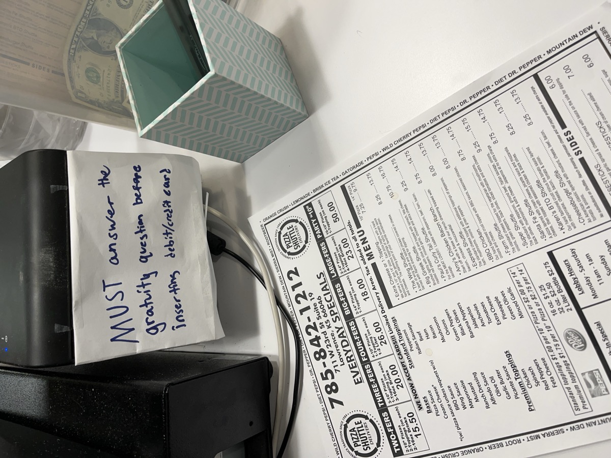 Card reader with gratuity reminder sign