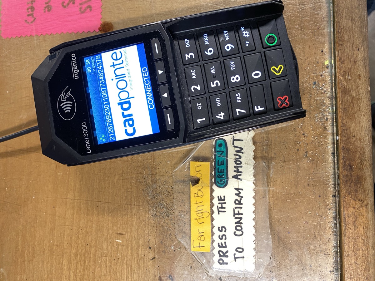 Card terminal with green button instructions