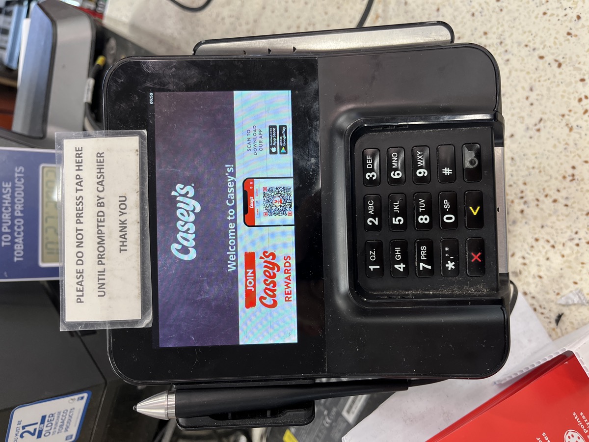 Casey's payment terminal with wait sign
